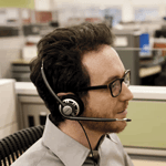 Profile of man with glasses wearing the HW710 headset
