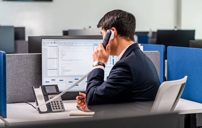 Office Worker At Desk Phone